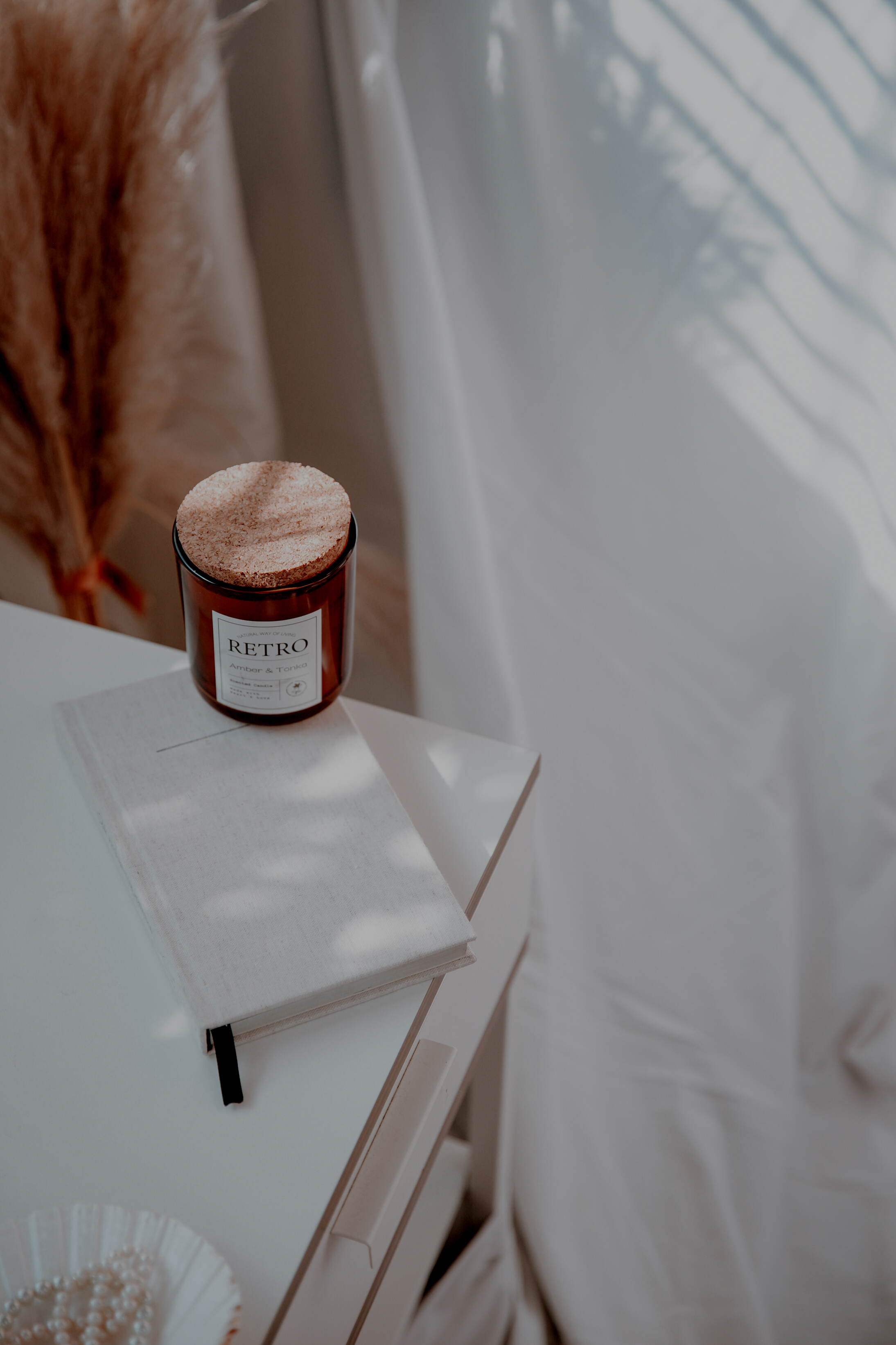 White candle and journal